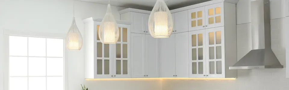 photo of elegant, textured glass pendant lighting over a kitchen island